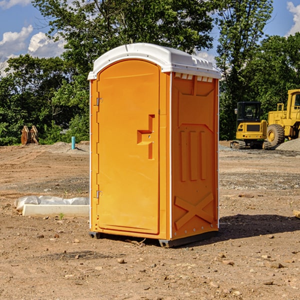 what is the cost difference between standard and deluxe portable restroom rentals in Maxwell